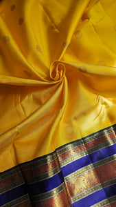 Yellow Korvai Kanchipuram with Navy border and blouse