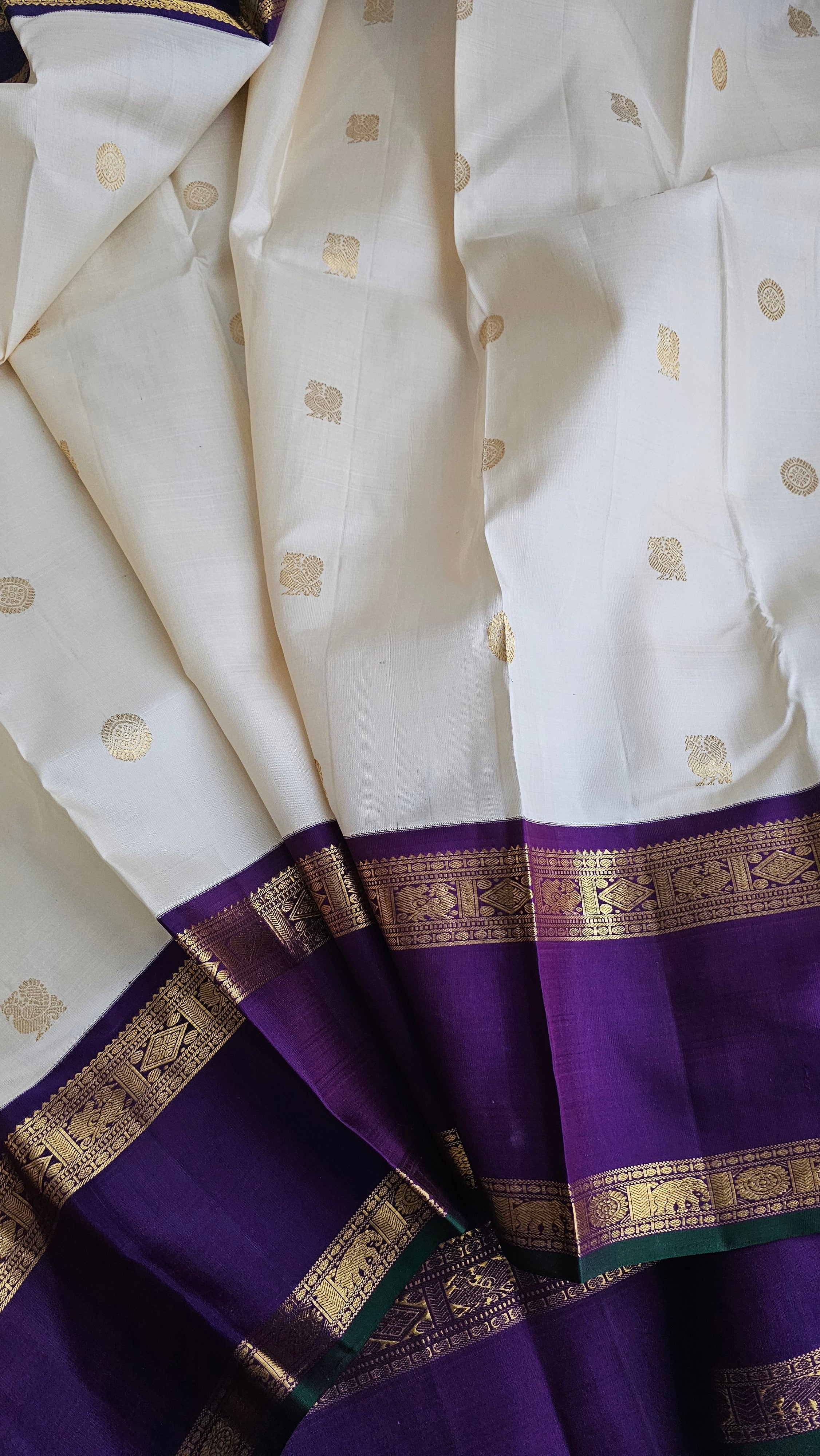 Cream Korvai Kanchipuram with a deep violet border