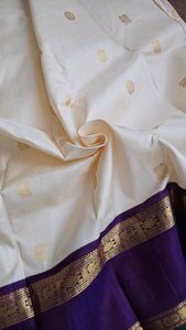 Cream Korvai Kanchipuram with a deep violet border